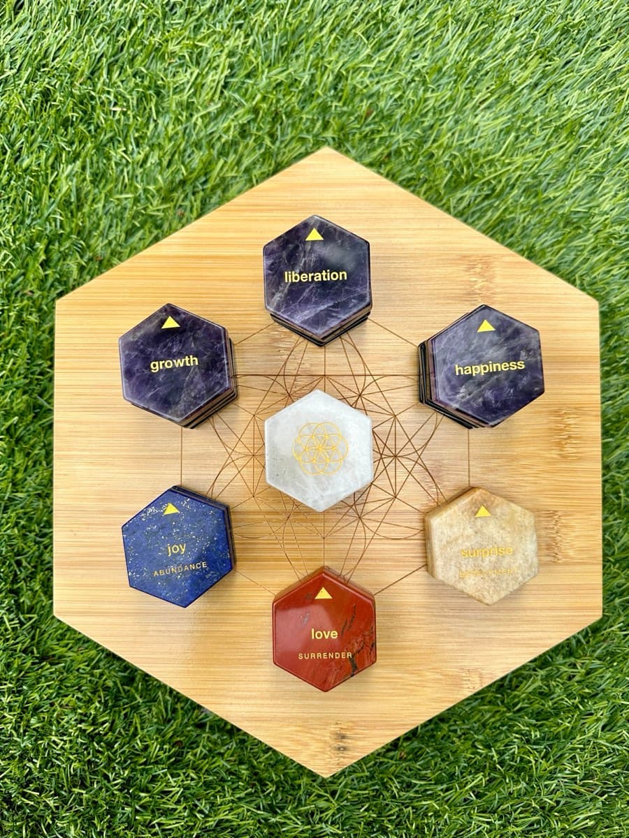 Liberation, growth and happiness stones around a clear quartz centre