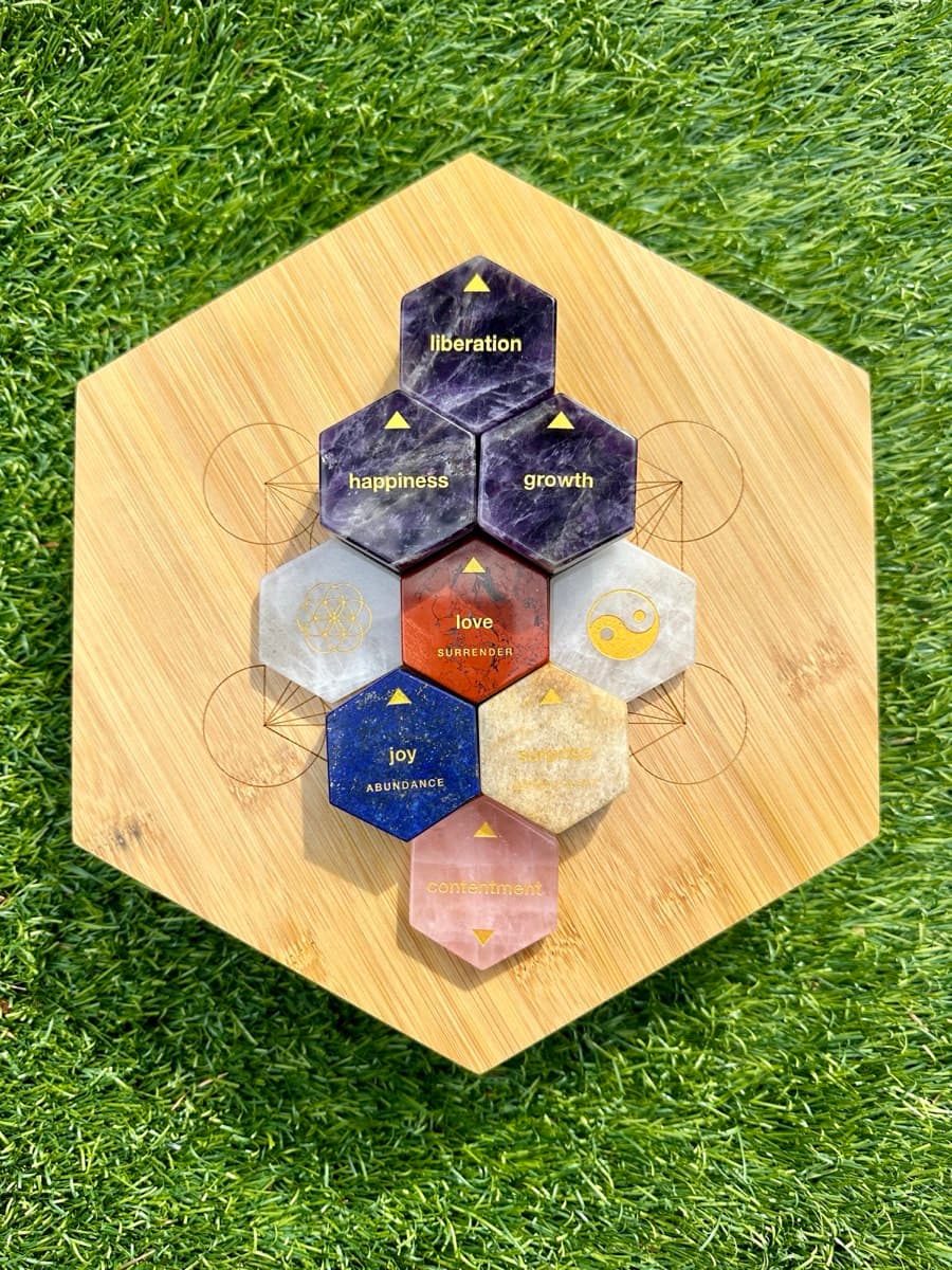 The Philosopher Stones: engraved amethyst, lapis, jasper and quartz hexagons on a bamboo board